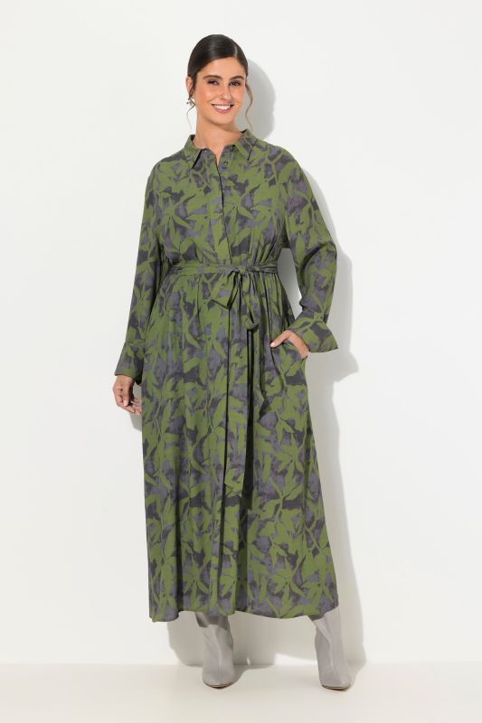 Robe maxi coupe évasée. Col chemise, manches longues et imprimé feuilles.