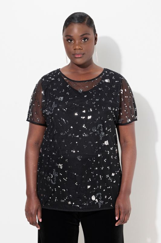 Blouse en mesh. Coupe oversize à manches courtes. Sequins et strass