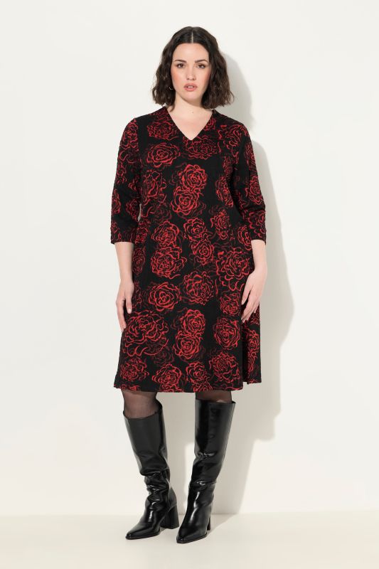 Robe en jersey, motif Jacquard, décolleté en V et manches 3/4, poches