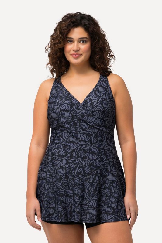 Robe de bain avec bonnets souples. Décolleté rond. Matière recyclée, imprimé coquillages.