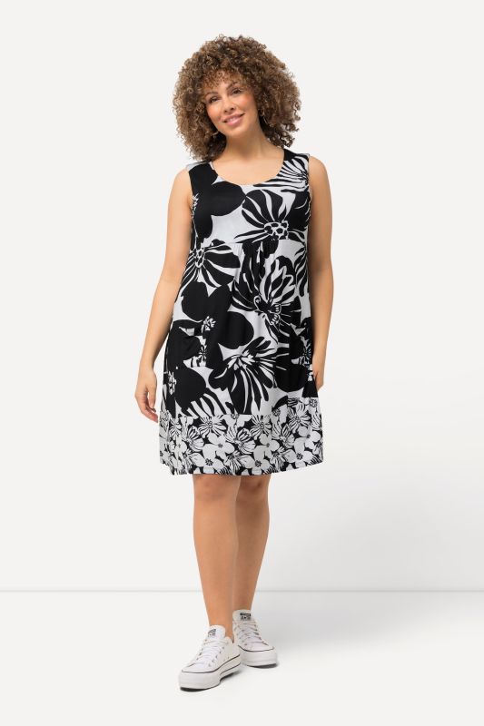 Robe mini sans manches. Imprimé à fleurs. Décolleté rond et ligne A