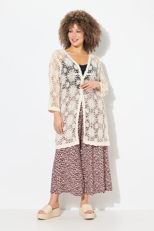 Cardigan motif floral, décolleté en V et manches longues, finitions vague