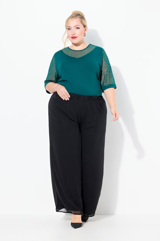 Pantalon double épaisseur, jersey et doublure en mousseline. Jambe large et taille élastique.