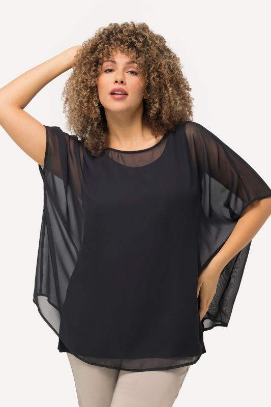 Blouse oversized en mousseline. Col rond et manches courtes