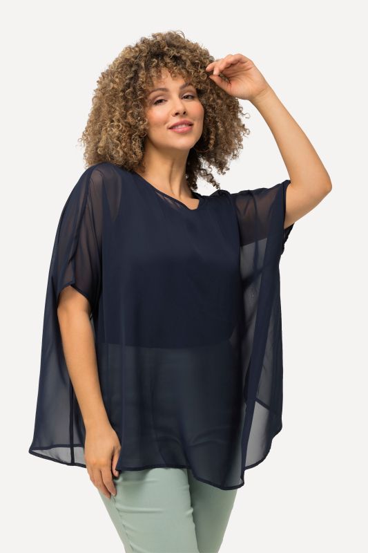 Blouse oversized en mousseline. Col rond et manches courtes