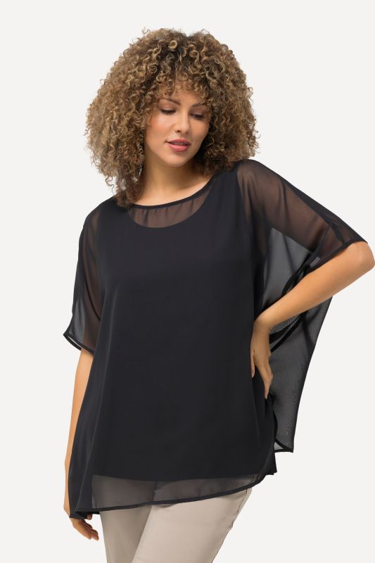 Blouse oversized en mousseline. Col rond et manches courtes