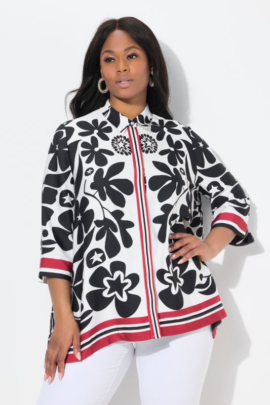 Chemisier en satin. Manches 3/4 et finition en pointe. Motif floral