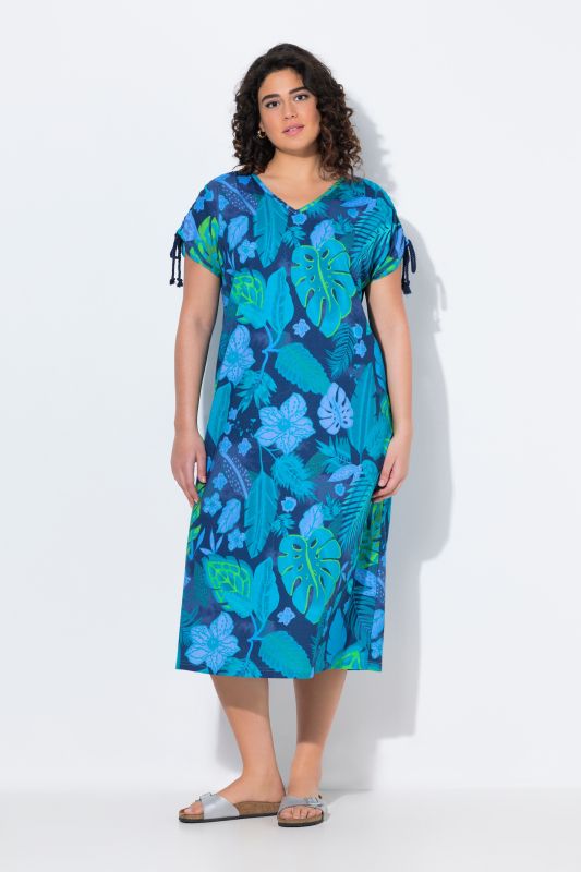 Robe midi en jersey. Décolleté en V et cordons à froncer. Motif floral et coupe évasée