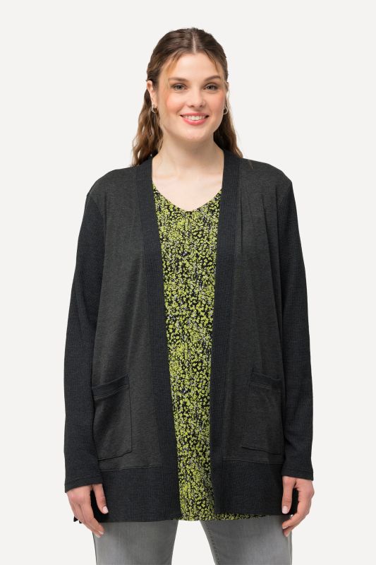 Veste en molleton, texture gaufrée. Coupe ouverte, manches longues.