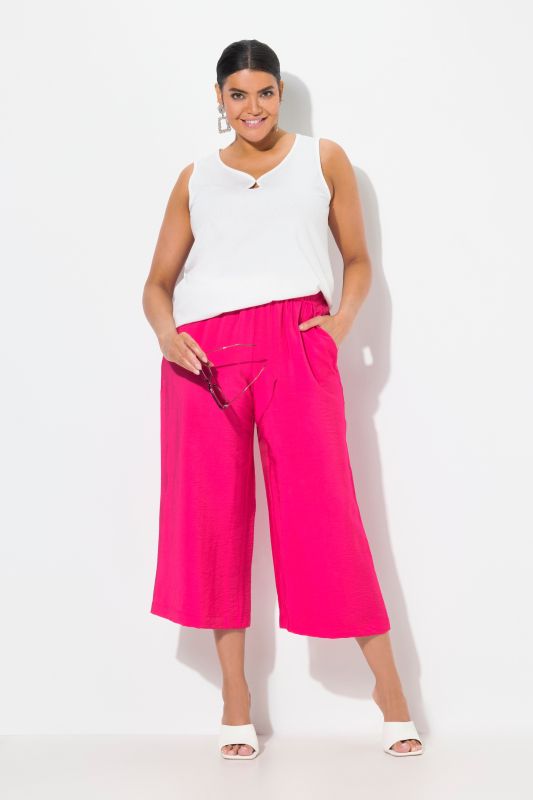 Jupe-culotte à jambe large et taille élastique. Tissu à texture irrégulière