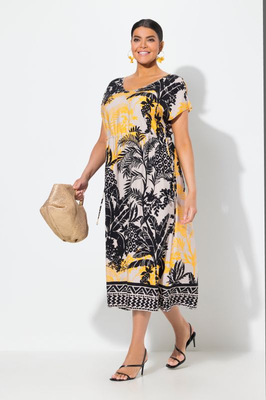 Robe maxi sans manches. Col en V et cordon de serrage. Imprimé palmiers