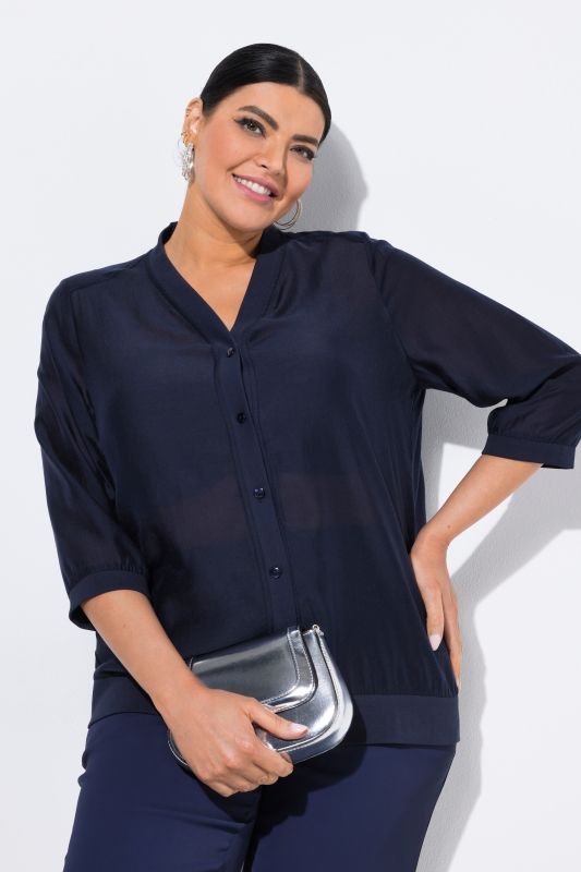 Blouse légèrement transparente, décolleté en V et manches 3/4
