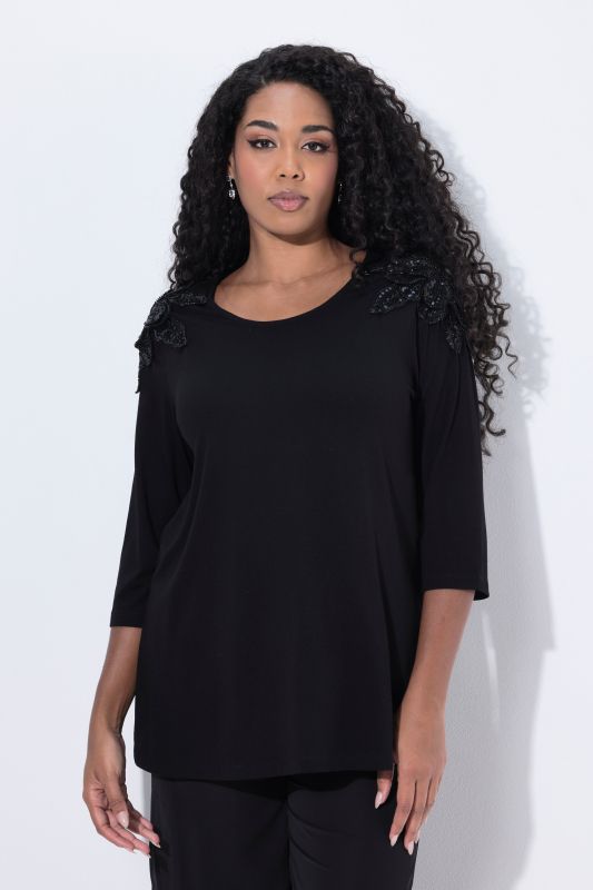 T-shirt avec fleurs en paillettes sequins, décolleté rond et manches 3/4, coupe évasée