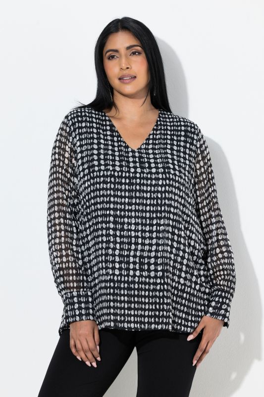 Blouse en mousseline doublée, décolleté en V et manches longues, coupe évasée