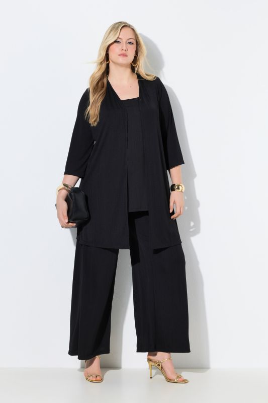 Gilet long en jersey côtelé. Coupe ouverte et encolure en V