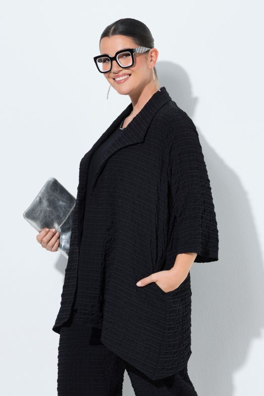 Veste col pelle à tarte et manches 3/4, coupe évasée, contient de la laine