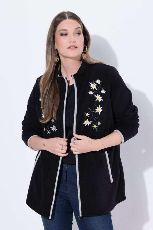 Veste en polaire esprit costume traditionnel bavarois. Fermeture zippée à double sens. Broderies edelweiss