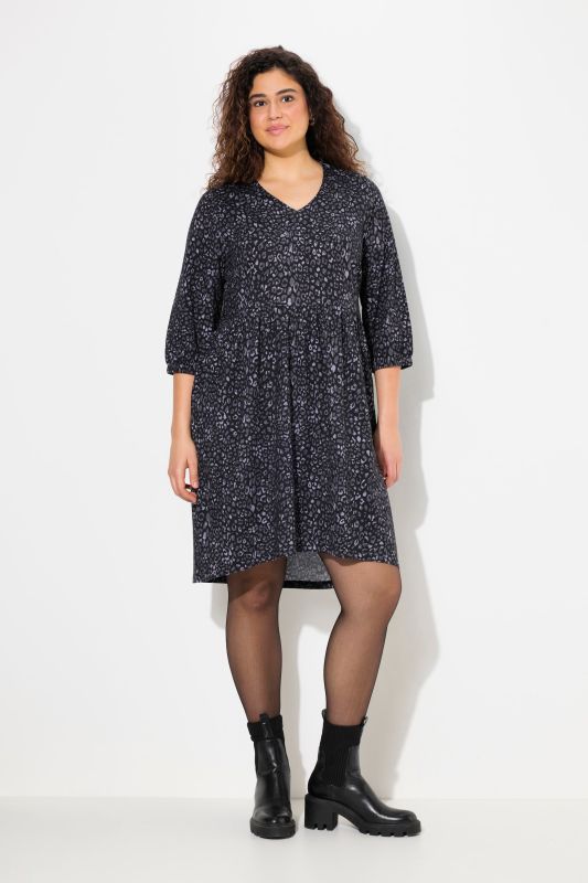 Robe en jersey imprimé léopard-étoiles, décolleté en V et manches 3/4, coupe évasée