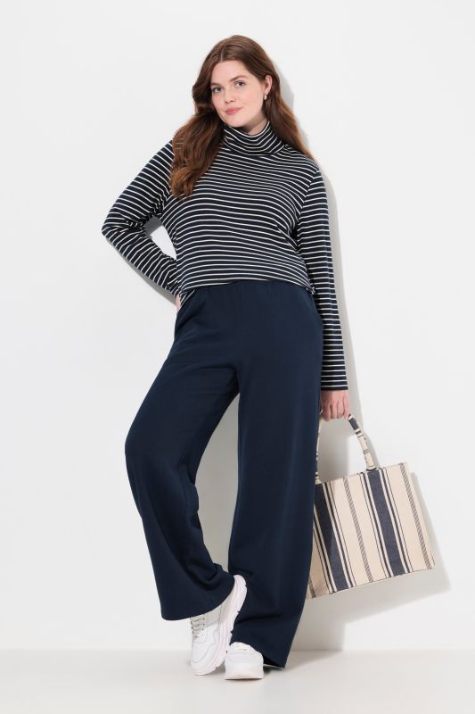 Pantalon en molleton de coton bio, à jambe large et taille élastique.