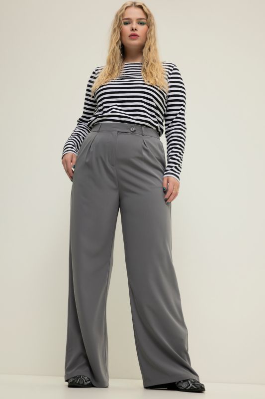 Pantalon à taille haute et jambe large. Pinces, taille partiellement élastique