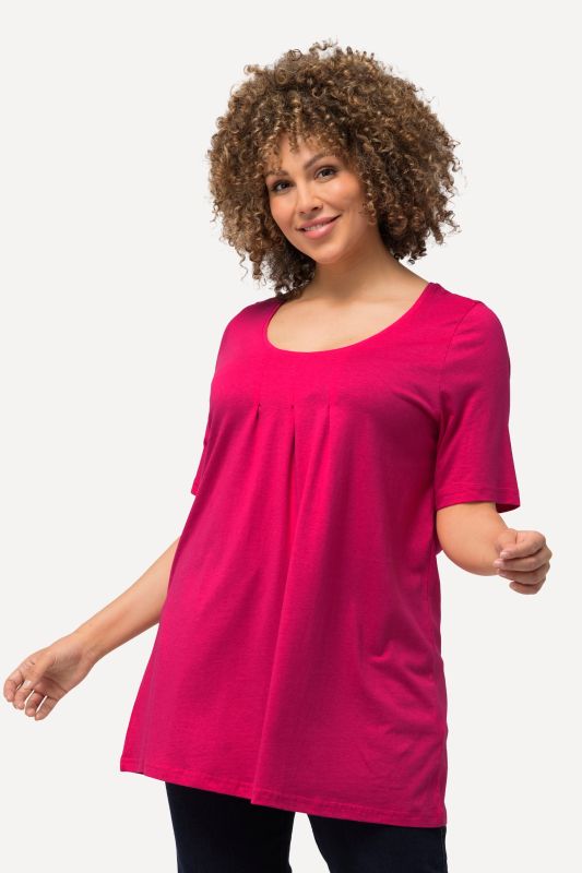 T-shirt en modal. Plis fantaisie, col rond et manches courtes. Coupe évasée.