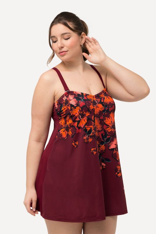 Robe de bain à bonnets souples. Bretelles réglables et motif floral. Matière recyclée.