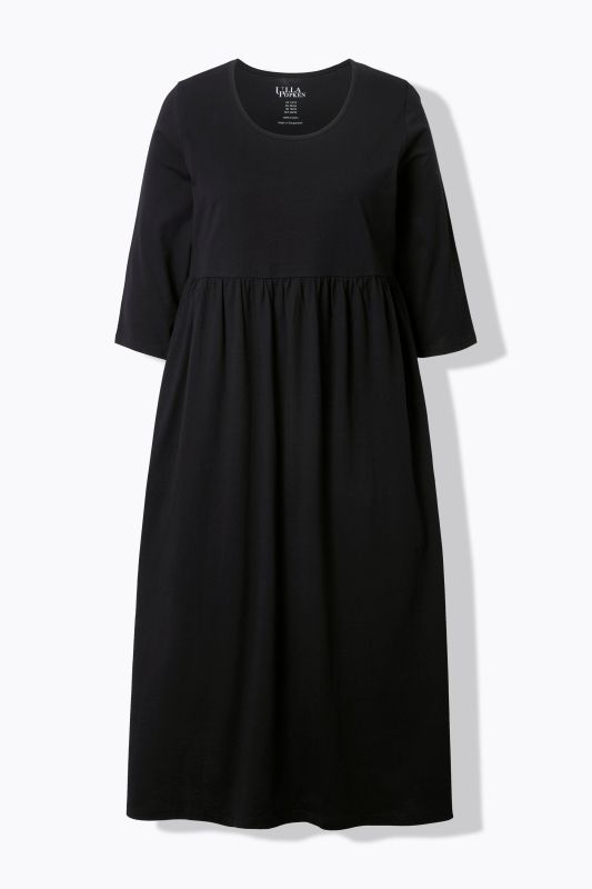 Robe maxi en jersey, avec poches. Coupe trapèze évasée. Décolleté rond et manches 3/4.