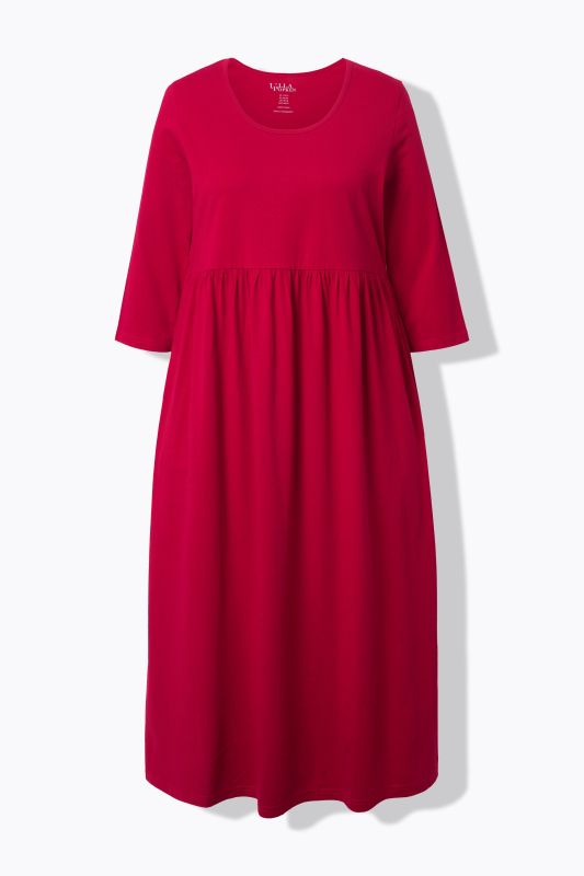 Robe maxi en jersey, avec poches. Coupe trapèze évasée. Décolleté rond et manches 3/4.