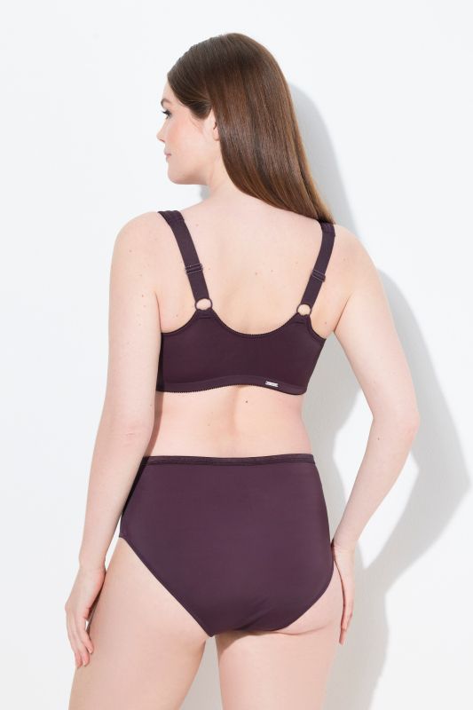 Soutien-gorge de maintien, sans armatures. Fermeture sur l’avant. Bonnet C-F.