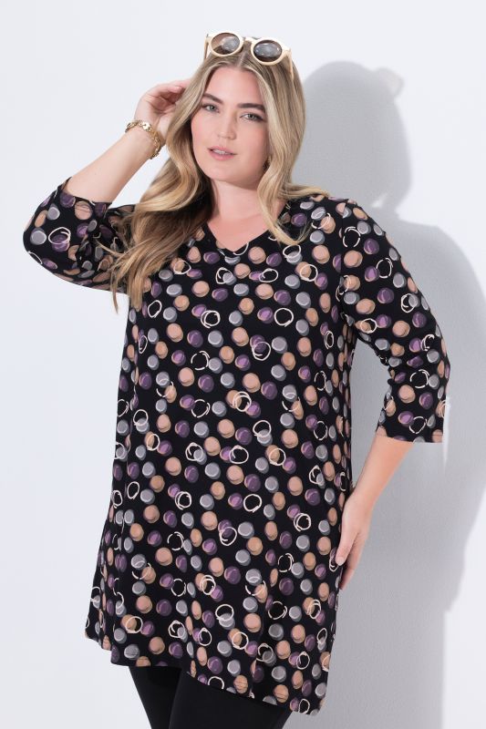 T-shirt long, motif à pois. Décolleté en V et manches 3/4. Coupe évasée