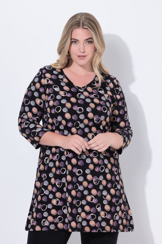 T-shirt long, motif à pois. Décolleté en V et manches 3/4. Coupe évasée