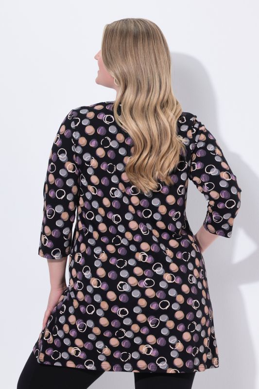 T-shirt long, motif à pois. Décolleté en V et manches 3/4. Coupe évasée