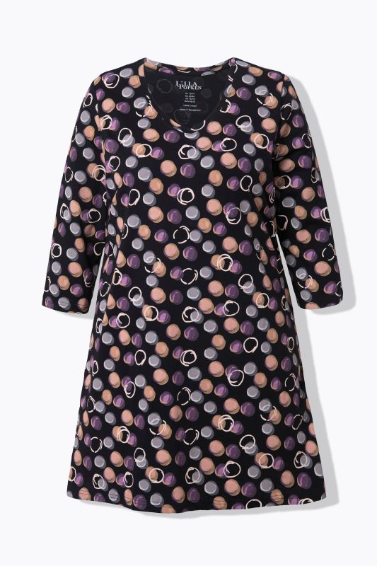 T-shirt long, motif à pois. Décolleté en V et manches 3/4. Coupe évasée
