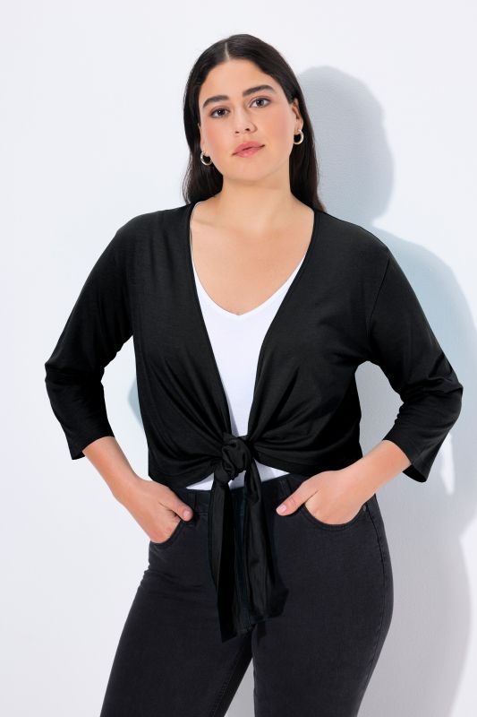 Boléro en jersey noué à la taille. Veste courte à manches 3/4