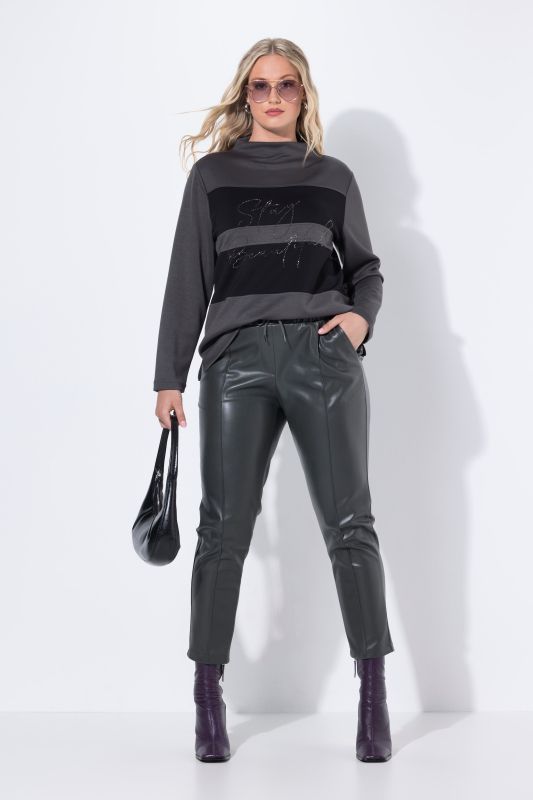 Pantalon 7/8 en similicuir. Passepoils et taille élastique