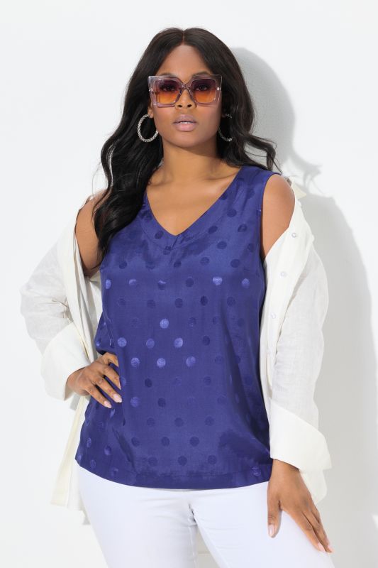 Blouse à pois jacquard avec encolure en V. Sans manches