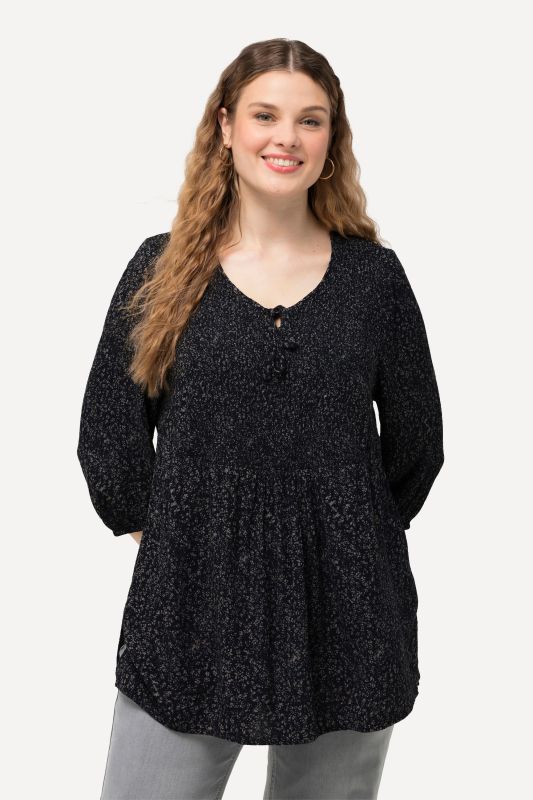 Blouse smockée à pois, décolleté rond et manches 3/4, coupe évasée