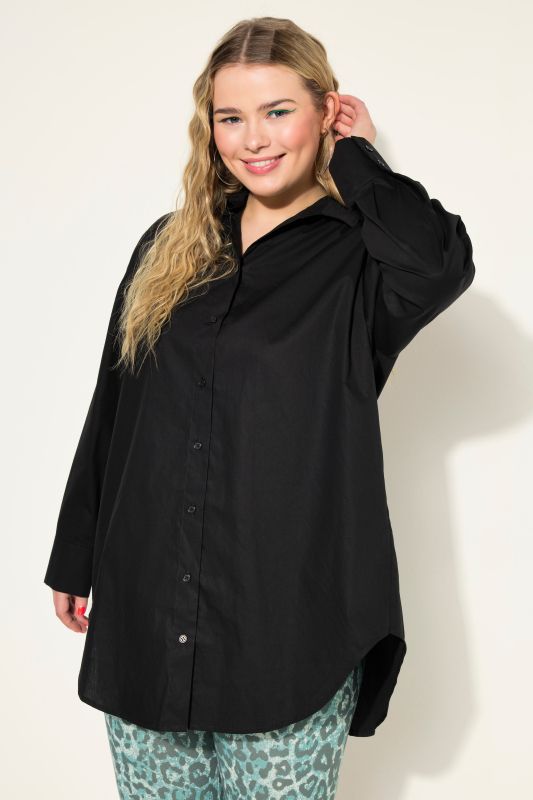 Bouse oversized à manches longues. Patte de boutonnage au dos