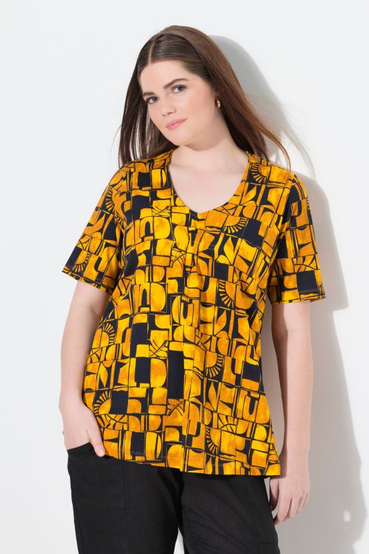 T-shirt en coton bio. Décolleté en V et manches courtes. Motif soleils