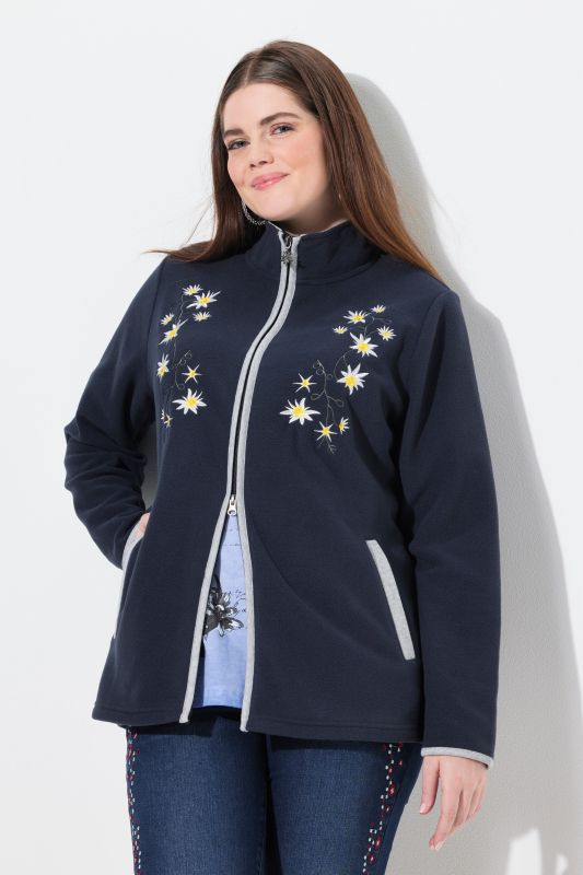 Veste en polaire esprit costume traditionnel bavarois. Fermeture zippée à double sens. Broderies edelweiss