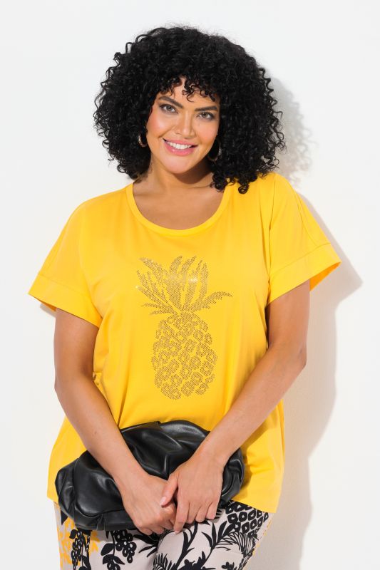 T-shirt oversize. Encolure ronde et manches courtes. Motif ananas à strass fantaisie