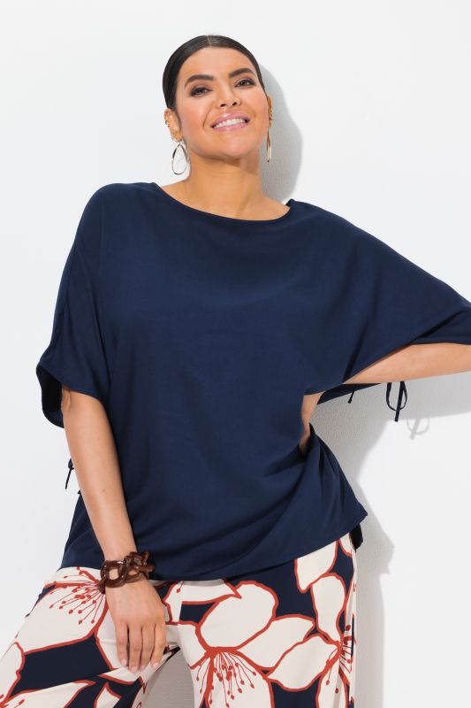 Blouse-tunique oversize. Col bateau et manches courtes