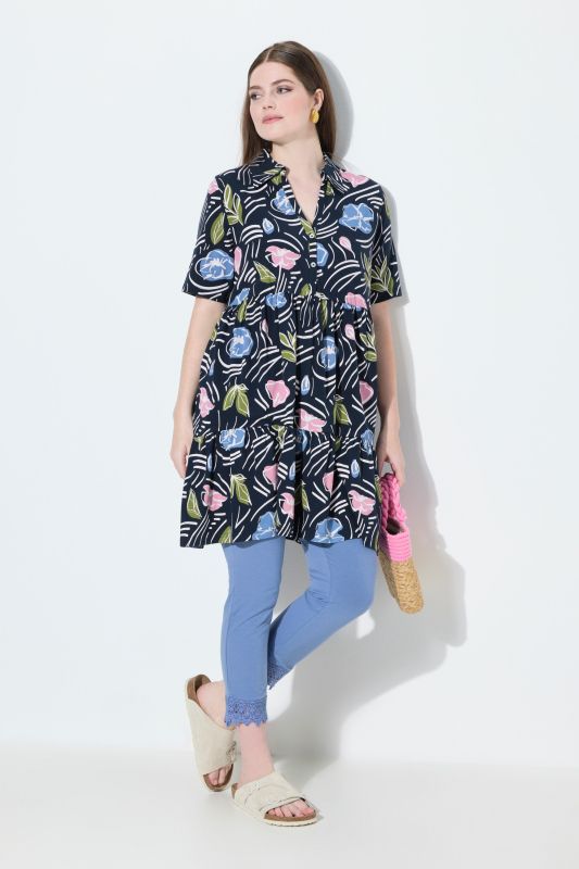 Blouse longue dans un imprimé à fleurs, coupe évasée, col polo et manches courtes
