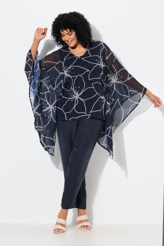 Blouse oversize à fleurs. Col en V et manches 3/4