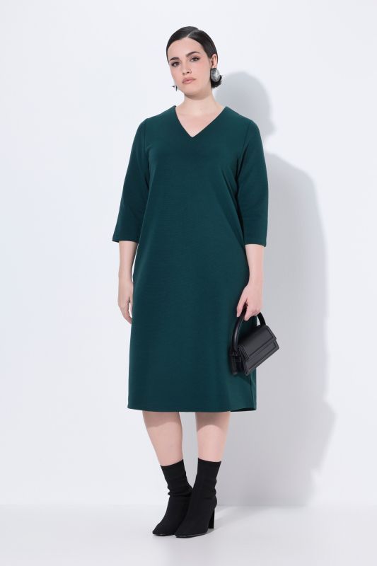 Robe en jersey avec poches, décolleté en V et manches 3/4
