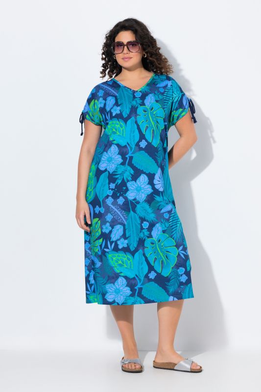 Robe midi en jersey. Col en V et cordons à froncer. Motif floral et coupe évasée