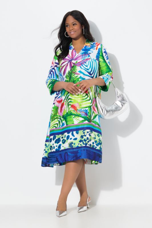 Robe midi en satin. Motif feuilles et coupe évasée. Manches 3/4 et col chemise