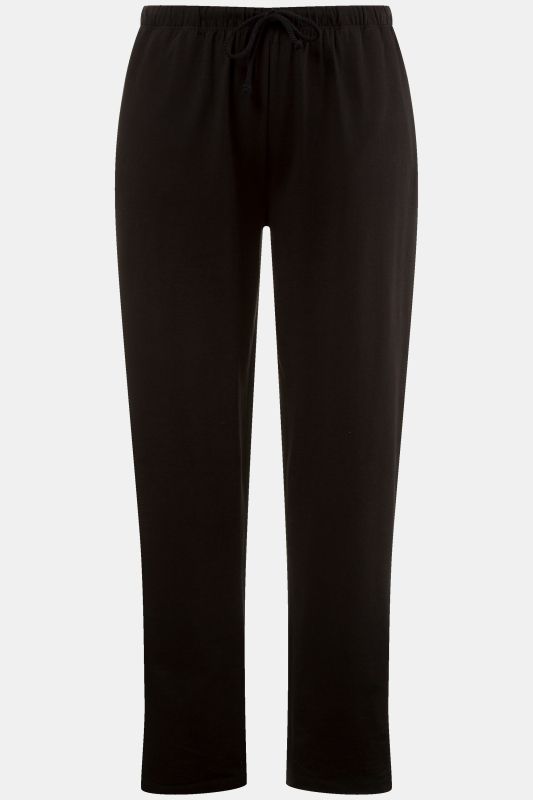 Pantalon Slim Fit à taille élastique. Bas de jambe légèrement fendu. Disponible jusqu’au 68/70.