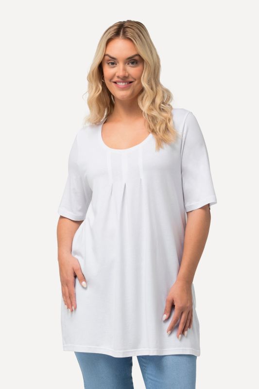 T-shirt en modal. Plis fantaisie, col rond et manches courtes. Coupe évasée
