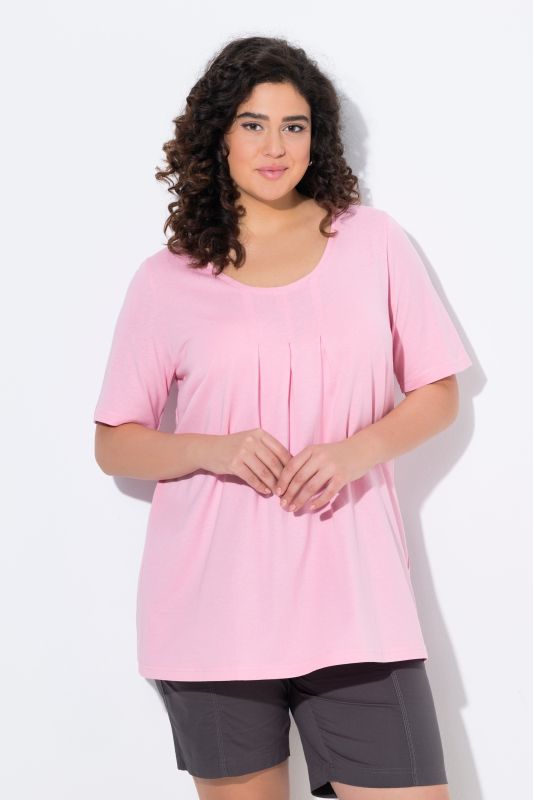 T-shirt en modal. Plis fantaisie, col rond et manches courtes. Coupe évasée